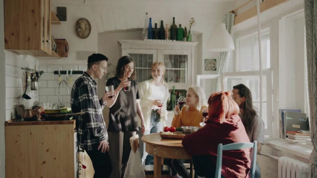 A group of Airbnb renters gathered around a table 